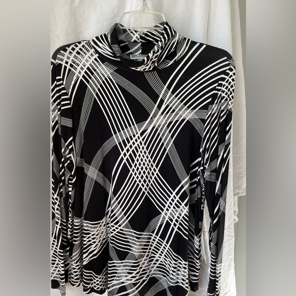 JM collection black and white Turtle neck blouse.